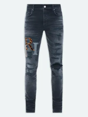 AMIRI STAGGERED LOGO JEANS INDIGO